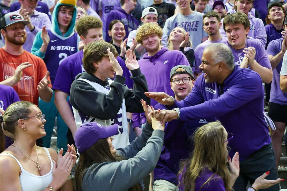 Nov 17, 2025; Manhattan, Kansas, USA; Kansas State Wildcats head coach Jerome Tang celebrates with students in the stands following a win against the Tulsa Golden Hurricane at Bramlage Coliseum. Mandatory Credit: Scott Sewell-Imagn Images