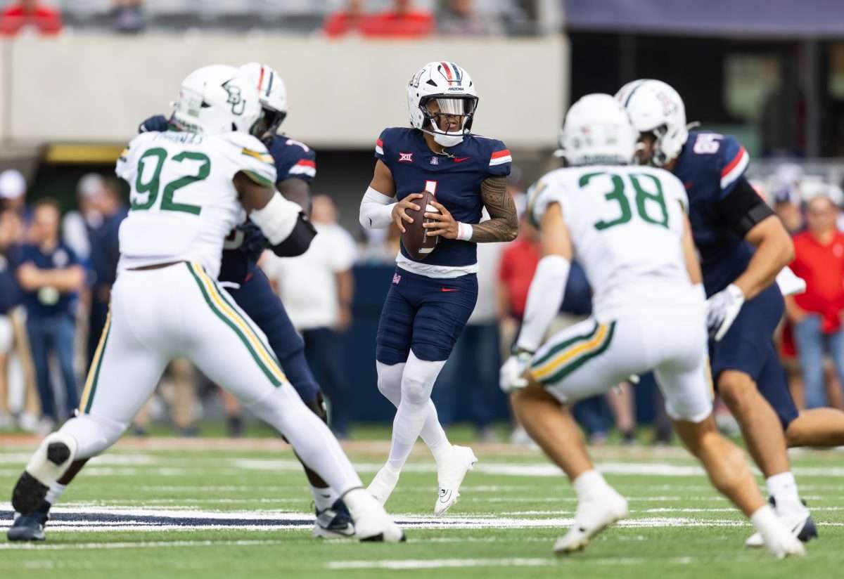 Nov 22, 2025; Tucson, Arizona, USA; Arizona Wildcats quarterback Noah Fifita (1) against the Baylor Bears in the first half at Casino Del Sol Stadium. Mandatory Credit: Mark J. Rebilas-Imagn Images