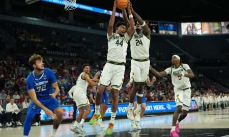 Nov 24, 2025; Las Vegas, Nevada, USA; Baylor Bears center Caden Powell (44) and guard Tounde Yessoufou (24) go up for the rebound as Creighton Bluejays forward Owen Freeman (32) looks on during the second half in a 2025 Players Era Festival group play game at Michelob Ultra Arena. Mandatory Credit: Kirby Lee-Imagn Images