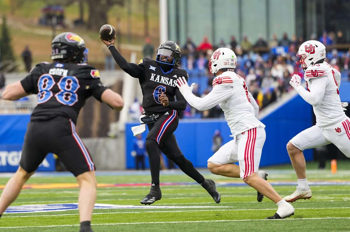 Nov 28, 2025; Lawrence, Kansas, USA; Kansas Jayhawks quarterback Jalon Daniels (6) throws a pass during the second half against the Utah Utes at David Booth Kansas Memorial Stadium. Mandatory Credit: Jay Biggerstaff-Imagn Images