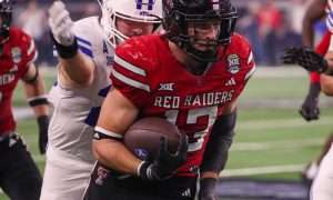Texas Tech's Ben Roberts returns the first of his two interceptions against BYU during the Big 12 Conference championship game, Saturday, Nov. 6, 2025, at AT&T Stadium in Arlington.