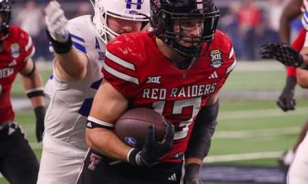 Texas Tech's Ben Roberts returns the first of his two interceptions against BYU during the Big 12 Conference championship game, Saturday, Nov. 6, 2025, at AT&T Stadium in Arlington.