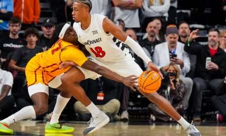 Jan 17, 2026; Cincinnati, Ohio, USA; Iowa State Cyclones guard Killyan Toure (27) steals the ball from Cincinnati Bearcats forward Baba Miller (18) in the first half at Fifth Third Arena. Mandatory Credit: Aaron Doster-Imagn Images