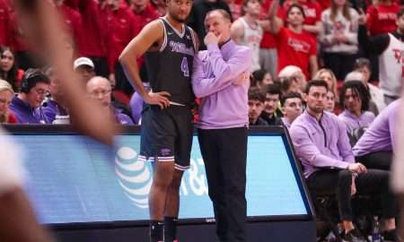 Kansas State interim head coach Matthew Driscoll talks to PJ Haggerty during a Big 12 Conference men's basketball game, Saturday, Feb. 21, 2026, in United Supermarkets Arena.