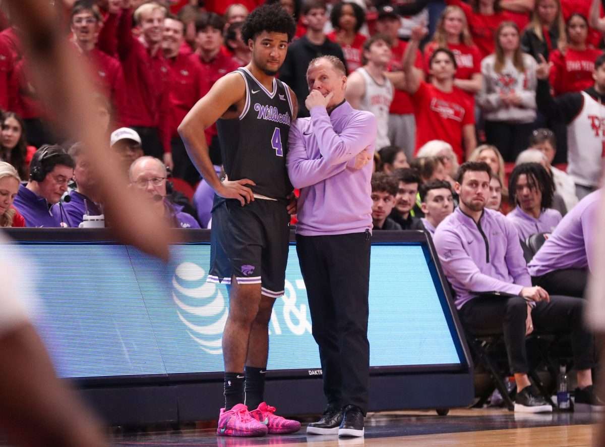 Kansas State interim head coach Matthew Driscoll talks to PJ Haggerty during a Big 12 Conference men's basketball game, Saturday, Feb. 21, 2026, in United Supermarkets Arena.