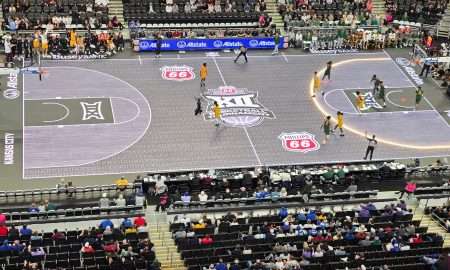 The 3-point line of the ASB GlassFloor LED court lights up during the Arizona State-Baylor game of the 2026 Big 12 men's basketball tournament, Tuesday, March 10, 2026, in T-Mobile Center at Kansas City. The Big 12 introduced the LED court to the conference tournaments this year.