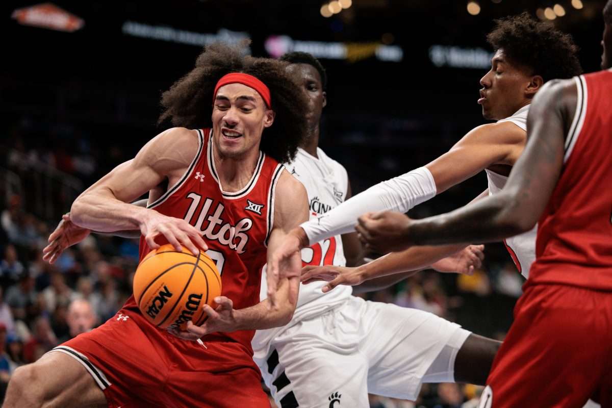 Mar 10, 2026; Kansas City, MO, USA; Utah Utes forward Keanu Dawes (8) rebounds during the first half against the Cincinnati Bearcats at T-Mobile Center. Mandatory Credit: William Purnell-Imagn Images