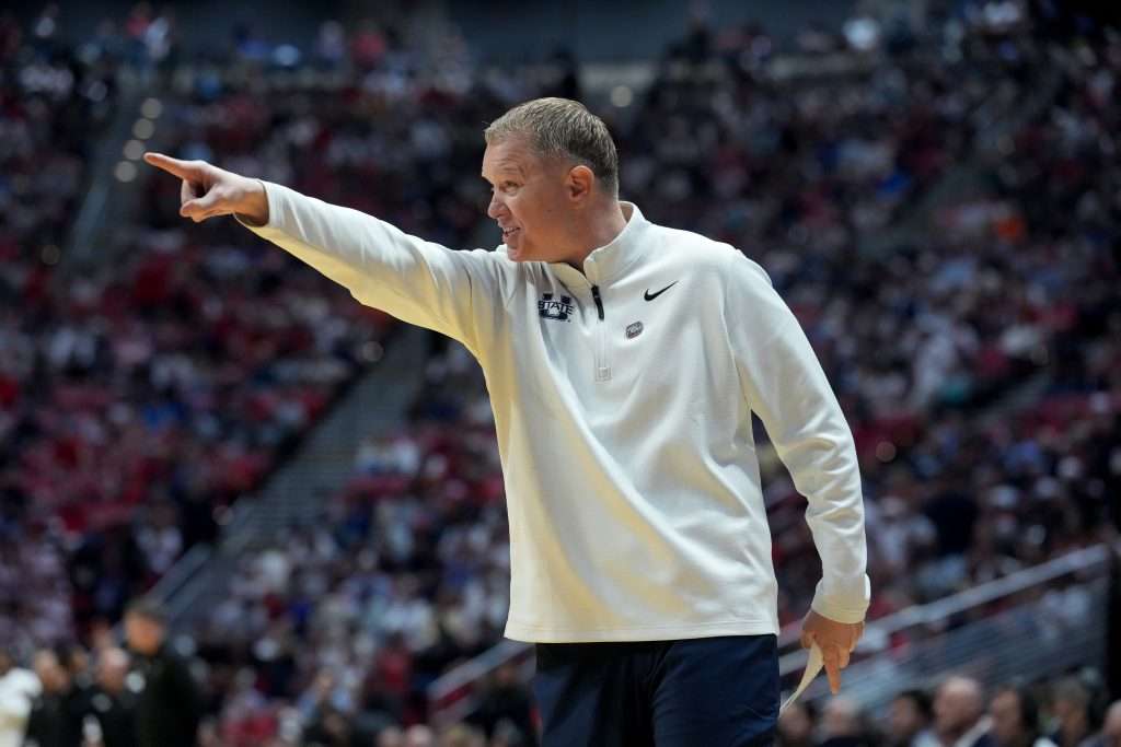 Mar 22, 2026; San Diego, CA, USA; Utah State Aggies head coach Jerrod Calhoun reacts in the first half against the Arizona Wildcats during a second round game of the men's 2026 NCAA Tournament at Viejas Arena. Mandatory Credit: Kirby Lee-Imagn Images