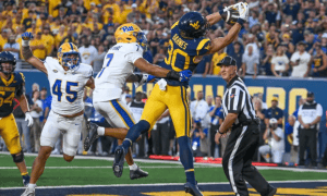 West Virginia wide receiver makes a catch against Pitt during the Backyard Brawl at Milan Puskar Stadium.