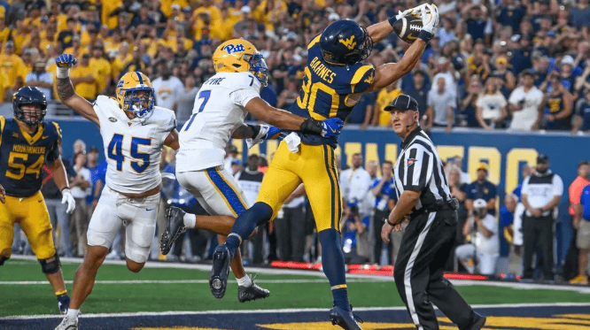 West Virginia wide receiver makes a catch against Pitt during the Backyard Brawl at Milan Puskar Stadium.