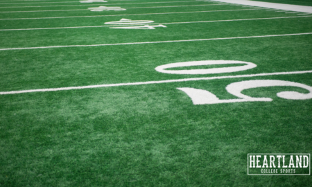 empty generic football field heartland college sports football news
